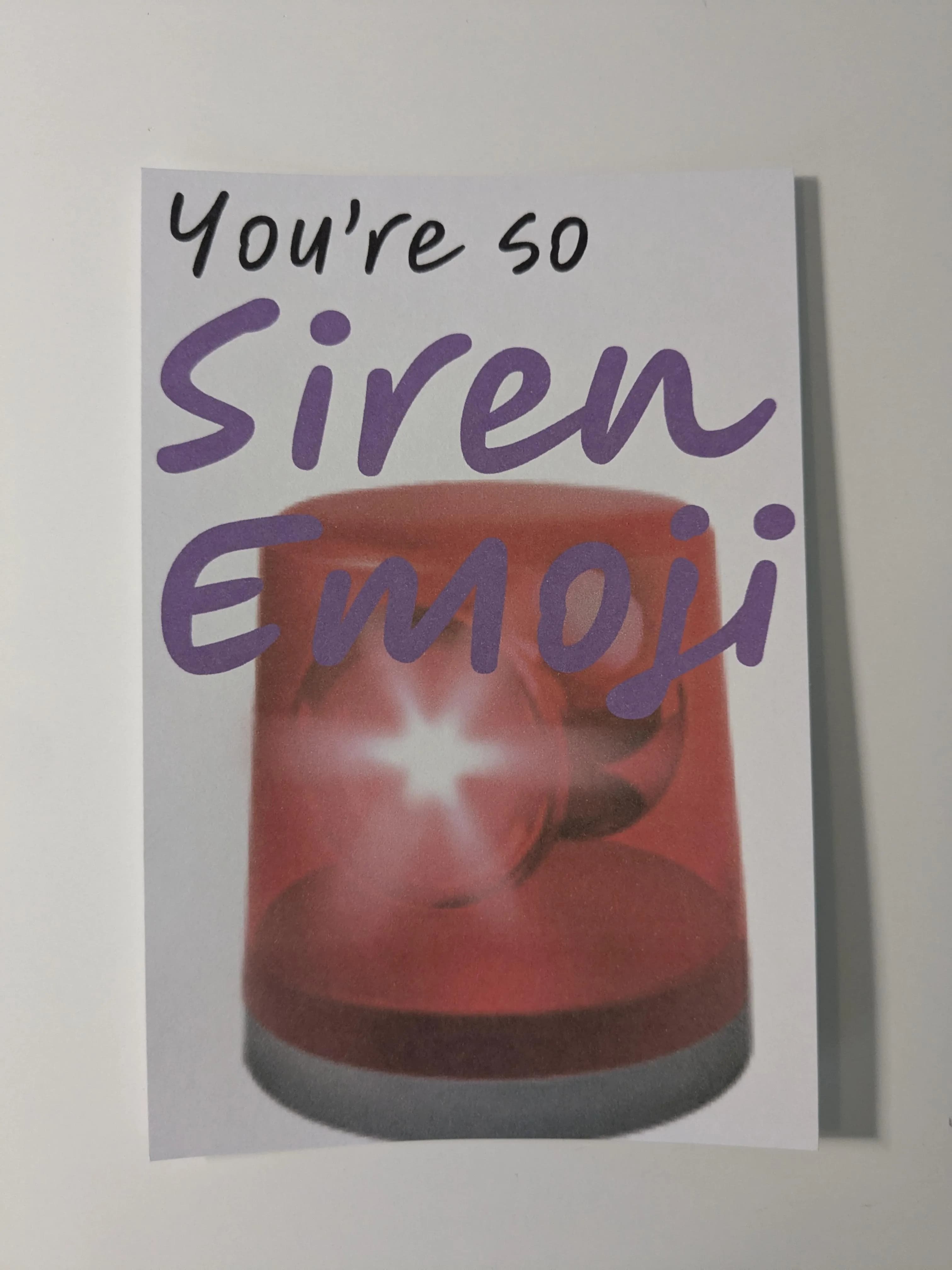 A postcard that says "You're so Siren Emoji" with a big Siren Emoji
